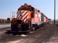 CP GP9 8634 heads up two hump sets, resting between duties at CP's Alyth Yard in Calgary Alberta. After the three remaining <a href=http://www.railpictures.ca/?attachment_id=32660><b>CP Train Masters</b></a> were retired in the mid-70's, CP started using GP-F7B-GP sets for hump duties. By this time the F-units were getting long in the tooth and nearing retirement, and many of the B's ended their lives working in hump service. Older roadswitchers like the 8400-series GP7's also found their way into yard and hump duty.
<br><br>
Three chop-nosed GP9's (8633, 8634 & 8635) were regulars at Alyth Yard, having been chopped in the early 70's as an experiment for better visibility in yard service (they also had their dynamic brakes removed). Note the unique "pointed" chop nose that some of CP's early chops received (only 8633-35, 8530 and 8492), along with the EMD-esque front numberboard assembly that became standard on CP's later Geep rebuilt program.
<br><br>
While most of the F's would be retired in the early 80's, the GP7 and GP9 fleet would be rebuilt and continue on in yard and local service for another few decades. CP 8634 would be rebuilt as GP9u 1579 and keep working yard duties until being retired and sold to ILSX as their 1319, then to DLCX.
<br><br>
<i>Keith Hansen photo, Dan Dell'Unto collection.</i>
