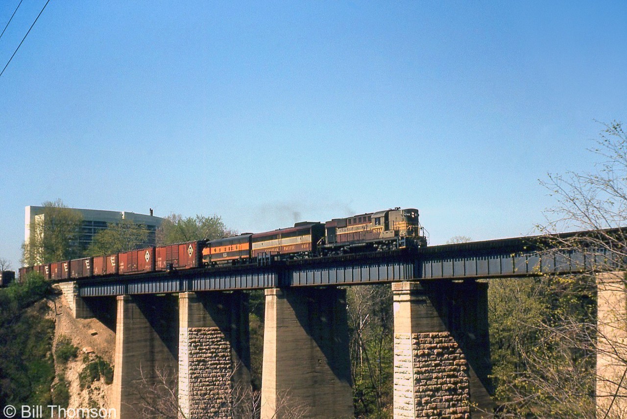 CP RS18 8744, FB1 4416 and a leased Bessemer & Lake Erie 700-series F-unit cross the Humber River bridge with an eastbound freight on the approach to Lambton Yard in May 1965.

The B&LE unit was one of a handful of foreign road units that power-short CP had on lease at the time. CP 4416 was one of the few FB1's that wasn't traded in to MLW on new C424 units in the mid-60's.