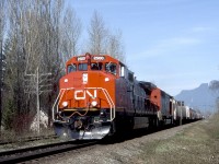 CNXW 2500, a GE Dash 9-44CWL, with the 5501 trailing at MP 65.3 - SNS Cheam View, and at full speed through Rosedale.