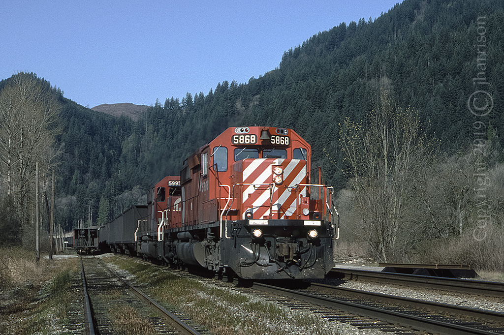 CPXE 5868 with the 5995 trailing is making it's way through Nicomen. The RCU's were CP 6024 and 5704. SNS Nicomen no longer exists but was, at the time, the next stop west of Harrison Mills B.C. GPS is approximate.