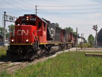 Here we see CN detour train 326 lead by 5484, 2541 and 8933 heading up the Chrysler Spur minutes before he hits the Chatham Sub. for London. This once lightly used branch line experienced quite the increase in traffic over the two weeks that the tunnel in Sarnia was closed. On top of the 2-4 trains per day, another 4-6 were added, testing the jointed rail at the curves. It was a fun experience chasing these trains as they offered a variety of power and freight that rarely if ever comes to Windsor anymore (seeing frame cars here again was choice), and I got to meet some new railfans/ hangout with old ones. Some good times indeed.