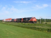 CN train #120 rolls into the town of Sackville after coming down the hill from Evans siding with 3860 leading the charge