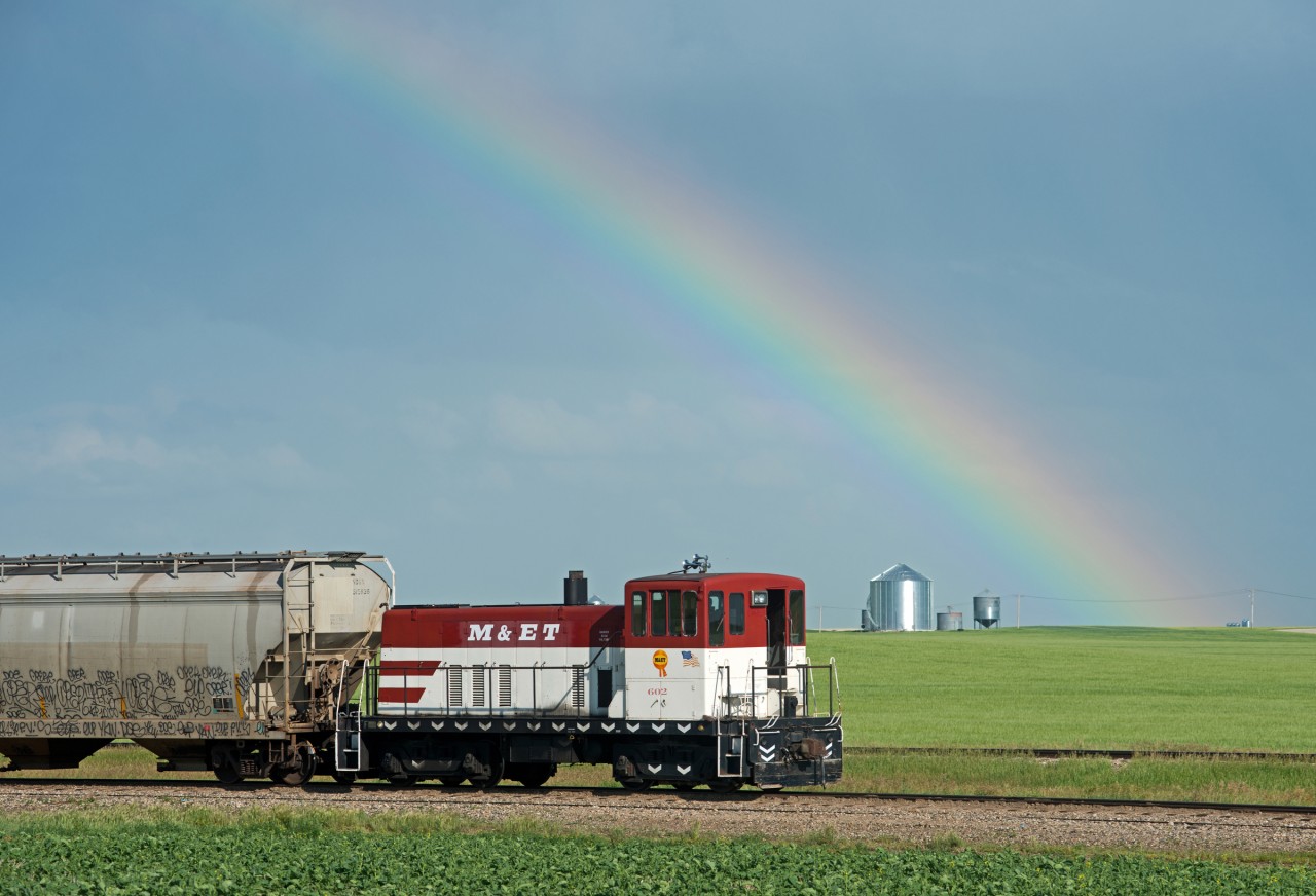 Positioned beneath a large rainbow, Big Sky Rail 602 is still in full M&ET colours.