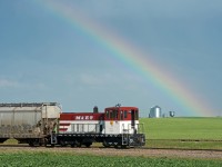 Positioned beneath a large rainbow, Big Sky Rail 602 is still in full M&ET colours. 