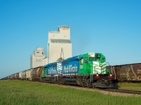 Big Sky Rail 6934 and 6935 lead a hefty train through Richlea Saskatchewan. 