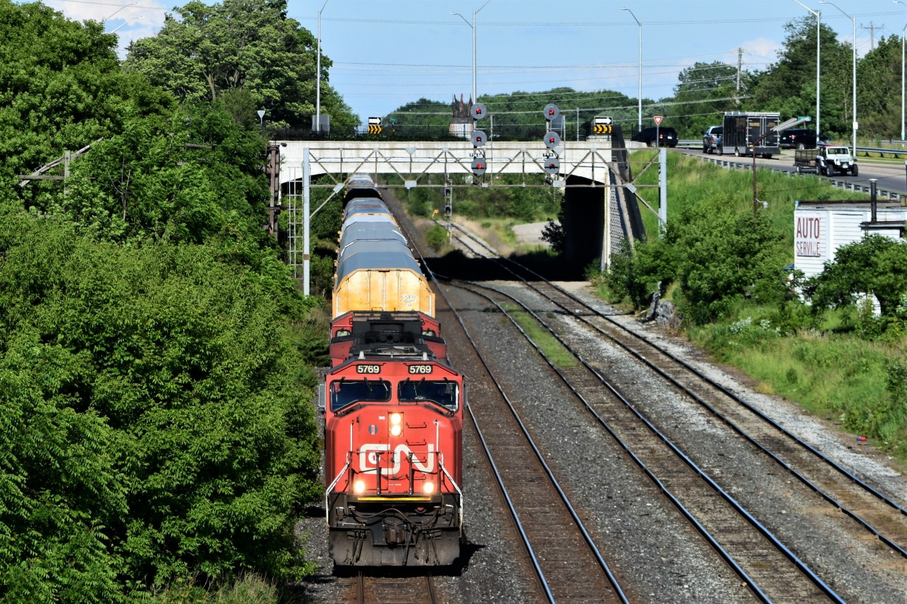CN 271 rolls East through London ON passing under the searchlights at the East end of London yard.
