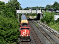 CN 271 rolls East through London ON passing under the searchlights at the East end of London yard.