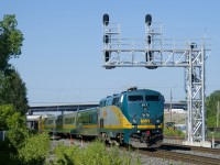 Unwrapped VIA 917 brings up the rear of VIA 63 as it passes through St-Henri.