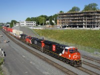 The leader on CN 120 (CN 3235) has only been on the property about a month and sports a white cab roof. Trailing are CN 2838 & CN 2966 on a shorter and earlier than usual version of this train (140 platforms).
