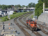 After taxiing to Taschereau Yard to get their power (GP9's CN 7229 & CN 4115), the Pointe St-Charles Switcher is returning to their namesake yard, where the power is usually based.