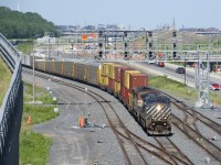 A pair of BC Rail units (BCOL 4649 & BCOL 4603) are the power on CN 401 as it passes Turcot Ouest. At the head end are 6 intermodal platforms from Rivière-du-Loup.