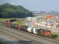 After having to change leaders before departing Southwark yard, CN X321 is approaching Turcot Ouest with repainted BCOL 4615 & CN 5761 for power and 126 cars. 4615 still sports class lights and double ditchlights.