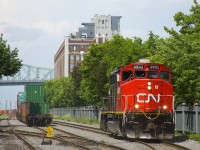 CN 9590 is heading light into the Port of Montreal to pick up some cars.