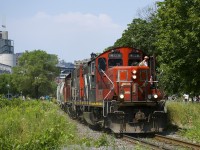 CN 4129 & CN 4700 are leaving the Port of Montreal with a 3500-foot long train on a scorching afternoon.