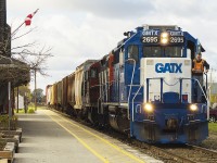 When CN started to lease the popular blue and white GMTX units, the railfans came out in droves just to capture these units. Out of sight, are fellow foamers <a href="http://www.railpictures.ca/author/hunterbholmes">Hunter Holmes <a/> and <a href="http://www.railpictures.ca/author/lukebellefleur">Luke Bellefleur. <a/> Here we enjoyed the likes of GMTX 2695 leading CN 514 past the old VIA station. Today's train will have no switching in Blenheim, but rather head straight for Thamesville.