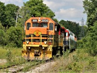 Goderich-Exeter Railway (GEXR) 580 slowly approaches the Bleams Road crossing on the Huron Park Spur with St. Lawrence and Atlantic Railway 3806 and RLK 4095, still in it's former RailAmerica colors. Train 580 has two cars for one of the last remaining customers on the spur, Ampacet Corporation Canada.  