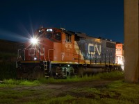 CN 4776 peaks around a support column for Nicola Tesla Boulevard in Hamilton. The crew of 555 was waiting to head into NSC to make a lift of new cars. 