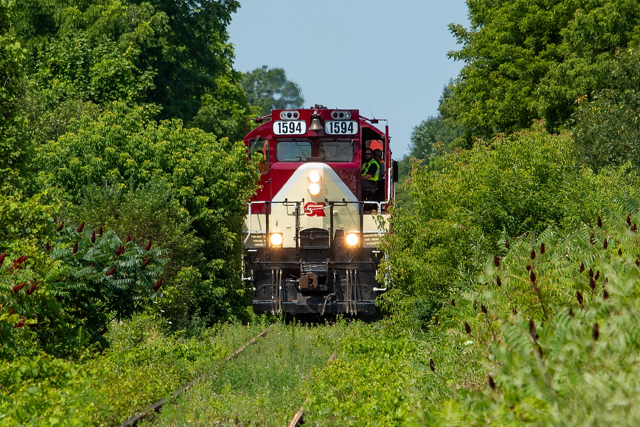 I had the week off last week, and managed to fit in a couple of chases of OSR (this, being the Cayuga Clipper as they call it, and the other being the St. Thomas Job). Having grown up in Simcoe, I have a fondness for the Cayuga, so this chase was at the top of my list. I was told ahead of time by an OSR employee that they don't send the "good paint" down the Cayuga Spur, and with this shot it's easy to see why. The line has become rather overgrown in places. To breakdown the day for anyone interested, 1594 and 8235 departed Salford light power shortly after 0730, and made their way to St. Thomas via Ingersoll. They lifted traffic for Future Transfer off of the Wabash Transfer in St. Thomas, and then headed eastward on the Cayuga. They stopped in Aylmer solely to weigh the power at the ethanol plant - why exactly, I am not entirely sure (if anyone knows why please comment - I thought perhaps maybe it was due to weight restrictions on the line but this is pure speculation on my part). After the stop in Aylmer they made their way to the south end of Tillsonburg (pictured here). They took in about 7 cars (a couple of tanks and some hoppers), switched Future for a good while, and then returned with about the same amount of traffic. A fun day and a great bunch on the crew.