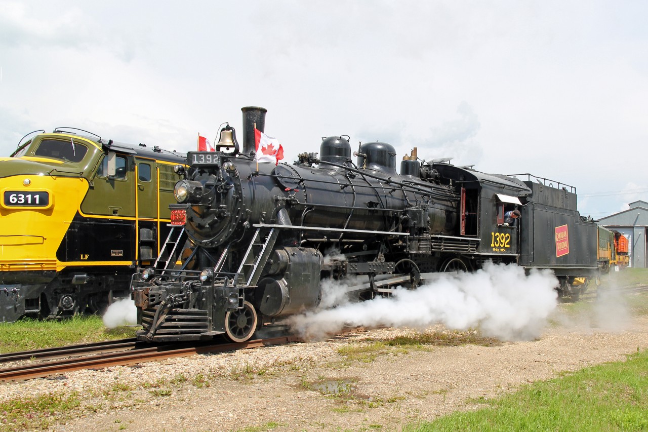 Alberta Railway Museum's 4-6-0 CN 1392 leaves the yard heading for the station to pick up it's passenger train.