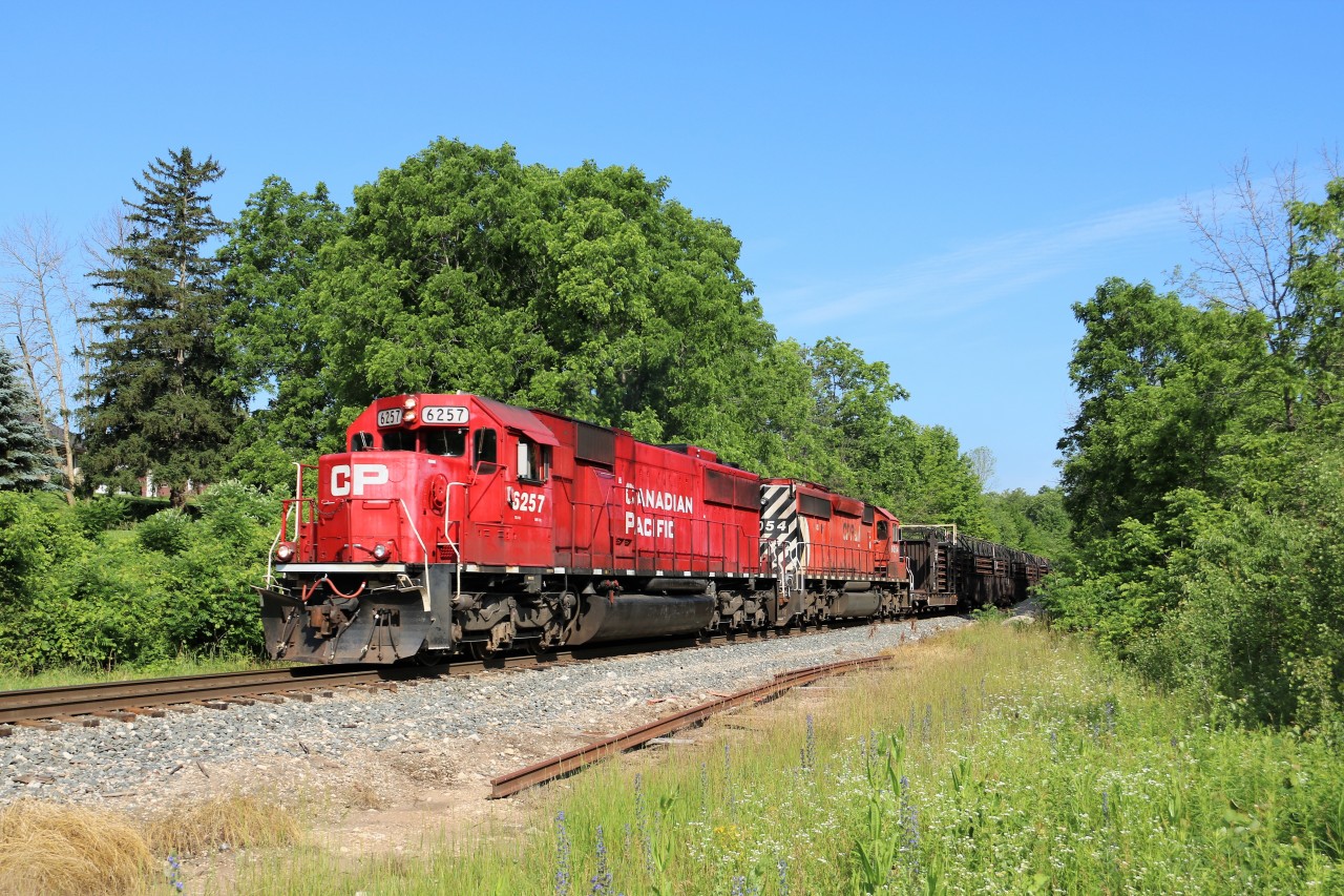 On a beautiful sunny morning, CP 6257 (SD-60) with CP 6054 (SD40-2) make their way out of Guelph Junction to park in Aberdeen Yard and await for CP 246 and CP 254 to clear.