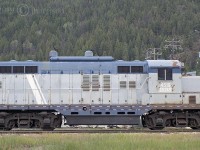 From another point of view: The ex GTW & IRRS EMD GP9 4519 was built in 1957. First numbered GTW 4919, the now Nelson and Fort Sheppard 4519, since 2012, is seen here shutdown in the siding at the Atco Wood Products mill in Fruitvale B.C. The mileage listed on the cross bucks at the entry crossing to the mill reads 149.91. At one time the unit delivered product from the mill to the U.S. border where there's a connection with the BNSF Nelson Sub. It might still but there are signs that the 4519 hasn't moved in a very long time. 

By coincidence there's a photograph by another photographer at another website dated 8/21/2018 that was taken from this exact vantage point. That photo is minus the car in the parking lot seen at the bottom front end of the unit, indicating that it probably hasn't moved in a very long time. The GPS reading for this photo is pin pointed on the roof of the unit.   