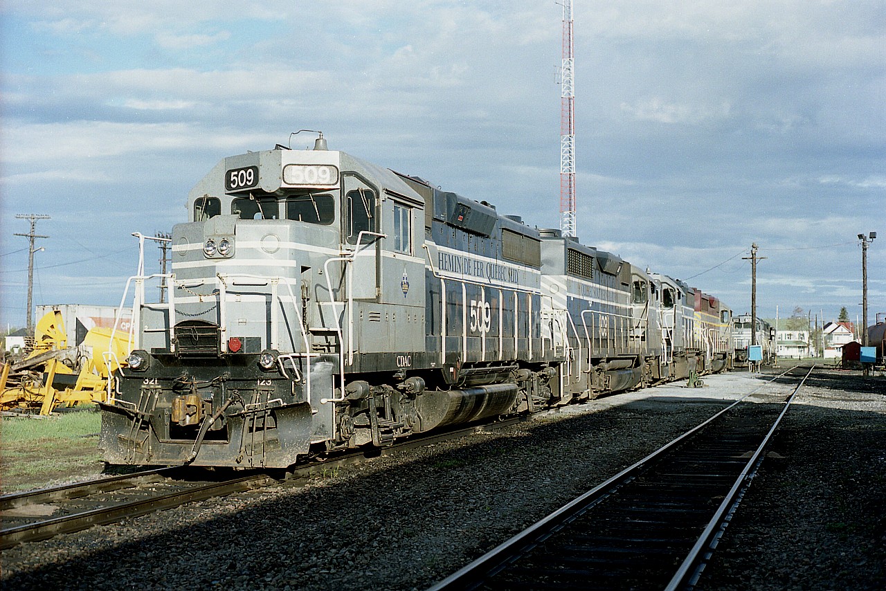 Former CP track that became reborn under "Iron Road" revived the Quebec Southern Railway name for a few years. The QSR was revived in 1996 and the Iron Road went bankrupt in 2002. Note the 'CDAC' on the locomotive, this is for 'Canadian American Railroad'. (Parent?) I found the various names confusing; perhaps someone can sort it all out......as there was also BAR and NVR (Northern Vermont) within the organization. Anyway, the whole set up went bankrupt by 2002 and the assets were acquired by MMA (Montreal, Maine & Atlantic) and they in turn went under, and it all became Central Maine and Quebec in 2014, comprising of the old CP Atlantic trackage as well as the former Bangor & Aroostook. And still is today.
Power seen: QSR 509, 508, 505 and NVR 513.
The downfall of the railroad could be blamed on deferred maintenance. Its a killer.