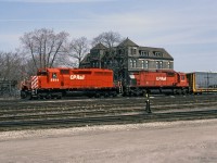 A pair of 3000 HP locomotives with train, CP 5504 (GMD SD40 built 1966) and CP 4571 (MLW M630 built 1969). <br>
Halted near the west end of CP's Quebec Street Yard in London ON, the crew could be awaiting a signal to proceed west to Windsor.