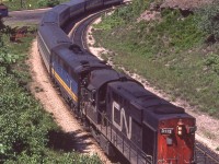 CN 3113's VIA train is eastbound leaving Hamilton West in Hamilton, Ontario on June 17, 1980.