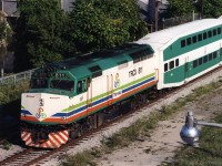 In 2001 GO Transit borrowed (leased) equipment from Miami area's Florida Tri-Rail and Vancouver's West Coast Express.<br> 
A train of this leased equipment was photographed the week after "9-11" heading north along the west bank of the lower Don River. Vantage point was Eastern Avenue bridge. It had departed Union Station eastward a few minutes earlier and would make station stops terminating at Richmond Hill. <br><br>
Florida Tri-Rail was equipped with bi-level coaches in the same colour scheme as GO Transit except for Tri-Rail emblems. Potentially this made it easier to sell the coaches (to GO) if South Florida commuter train service was not viable. However Tri-Rail's 480 Volt HEP (matching Amtrak, VIA, WCE, etc) is incompatible with GO's 575 Volt system. 