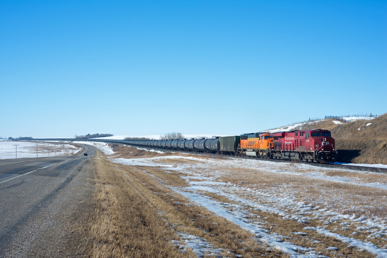 Eastbound crude oil loads from Rosyth Alberta are making good time just west of Biggar Saskatchewan. The clean EMD trailing was a nice change from the norm.