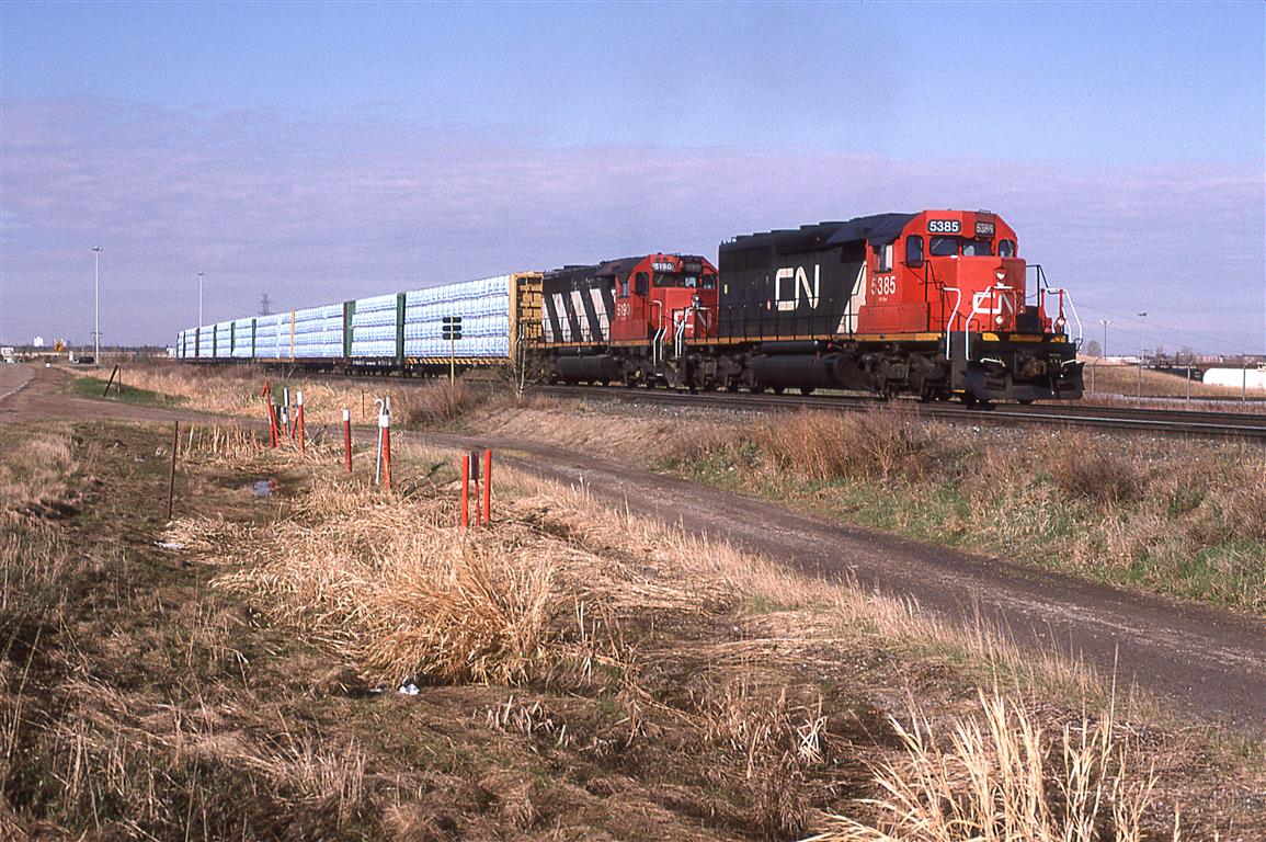 A typical wood product train from Prince George BC, the 360 was a pretty frequent traveler on the Wainwright Sub. Two Spartan can SD-40's leading, however was rare.
