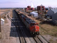 716, an empty sulpher train heads south out of Edmonton on the Camrose Sub. It is headed to Ram River via the Brazeau Sub. Apparently these sour gas field that have the hydrogen sulphide stripped and reduced are still going strong.
My wife and kids are on this chase, therefore we did not get much beyond Camrose. Note how sunny that it is.