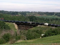 419, the regular Edmonton to Smith AB manifest train winds though the Sturgeon River Vally just north of Edmonton. I could have used one or two more tank cars on the rear of the train.