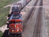 Just another Edmonton to Vancouver grain train departing town.
Inland Cement dominates the background, but there is an asphalt plant just this side of Inland. Apart from trees growing along the RR ROW, and a landfill mountain, this view has is pretty much the same today.