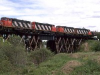 Fred Clark and I decided to shase this train, in less than ideal conditions. Here it is on the Sangudo Sub, crossing the Sturgeon River in St Albert, just NW of Edmonton.
Beside the local, this track hosts unit train from the sour gas fields where there are a couple sulphur extraction plants. 