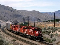 This Auto and double stack train passes the huge gravel pit operation in Walhachin,
CP was transitioning away from the stripes and pacman symbols, but at least the GE's weren't showing up yet.