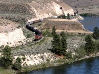 This westbound grain train skirts First Nations' land, and the Thompson River which it will cross in a moment.
The 2400 leading is using the "Canadian air conditioning".