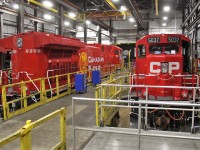 A rebuilt AC4400 (now an AC4400CWM) poses in the shop beside a rebuilt SD40-2 (now an SD30eco)