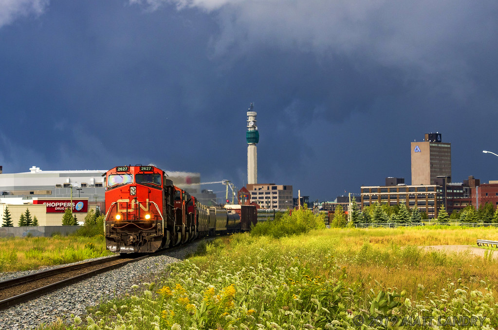 After heading through severe thunderstorms in Moncton, New Brunswick, a pocket of sunshine appears, as train 407 rounds the bend near the VIA Rail station.