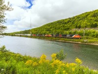 In a great scenic spot, train 407 heads through Folly Lake, Nova Scotia with 5 engines on the point.