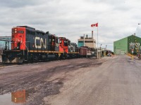 Taking a break from mainline trains, two friends and I ventured down into Hamilton’s Ontario industrial core for the first time during a spring morning in 1995. I remember at the time we were overwhelmed with the maze of tracks and all the industries that were still served by rail as well as all the industrial units that were working behind the seemingly endless rows of fences. However, not long into our tour, we came across CN GP9RM 7031 and SW1200RSM 7305 switching the Stelco Steel Rod Mill facility. We took a few photos and also shot the pair working the nearby Stelwire Parkdale plant. I believe that at least one of these industries still receives rail service today; however corrections and additional information are both welcome and would be appreciated. 