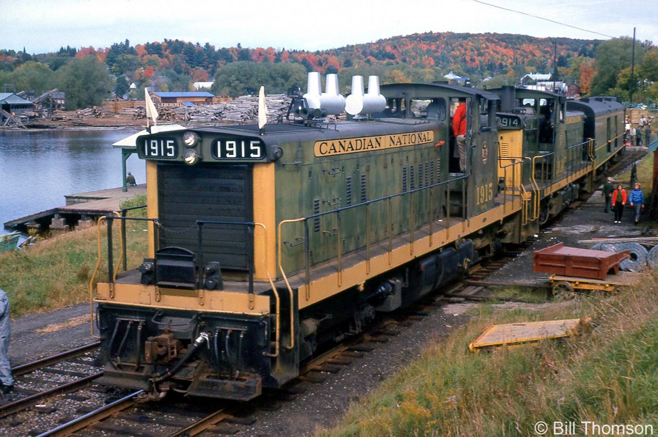 CN GMD-1's 1915 and 1914, in matching yellow and green paint, lead a UCRS fantrip on September 22nd 1963. The train is seen here stopped at Haliburton for a photo-op, at the northernmost end of CN's Haliburton Subdivision (Mile 55.5). The two GMD-1's handled the fantrip from Lindsay to Haliburton, after CN Northern 6167 handled the train northeast from Toronto to Lindsay.

The two 1900's leading the train near Kinmount: http://www.railpictures.ca/?attachment_id=17673