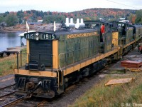 CN GMD-1's 1915 and 1914, in matching yellow and green paint, lead a UCRS fantrip on September 22nd 1963. The train is seen here stopped at Haliburton for a photo-op, at the northernmost end of CN's Haliburton Subdivision (Mile 55.5). The two GMD-1's handled the fantrip from Lindsay to Haliburton, after CN Northern 6167 handled the train northeast from Toronto to Lindsay.<br><br>The two 1900's leading the train near Kinmount: <a href=http://www.railpictures.ca/?attachment_id=17673><b>http://www.railpictures.ca/?attachment_id=17673</b></a>