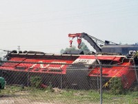 CN RS18 3151, one of the six RS18 units CN rebuilt for the new Tempo train corridor service that started just a few months before in June 1968, sits on its side after derailing on Sarnia to Toronto Tempo train #150 one mile east of Oakville. CN crane 50109 in the background is on the wreck train, working cleanup duty at the site.
<br><br>
For an overview photo of the derailment, see: <a href=http://www.railpictures.ca/?attachment_id=38626><b>http://www.railpictures.ca/?attachment_id=38626</b></a>