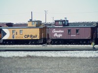 Interesting view comparing paint schemes on a couple of old CP cabeese from 40+ years ago. (Note Northern Pacific boxcar in behind!)
