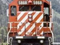 CP 5868, listed as sold for scrap in 2017, is seen here at Field on CP's Mountain Sub. Trailing units were the 5760 / 9004 / and the NS 1597.