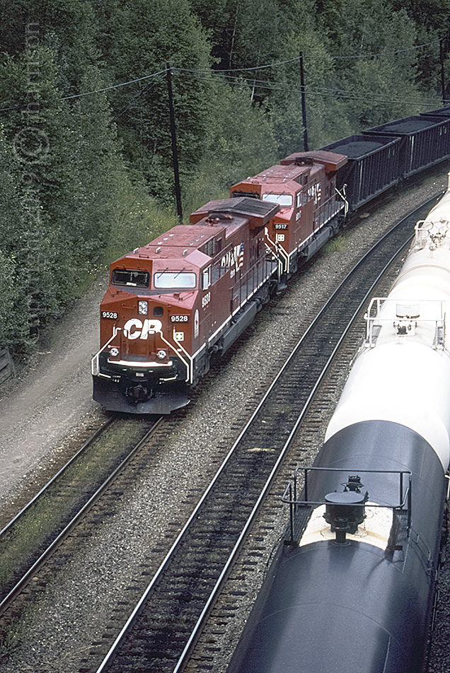 CP 9528 with the 9517 trailing are westbound at White, now known as Woodman, and less than a Km from Revelstoke, on CP's Mountain Sub. The RCU with this train was CP 9536. GPS is approximate.