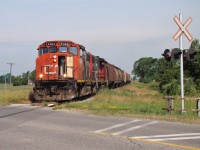 CN 4784 and 4785 lead a 10 car local to Blenheim seen here crossing Middle Line just outside of town.