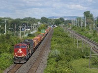 CP 8116 & CSXT 232 lead CP 143 through Pointe-Claire.