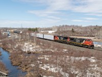 This southbound CN manifest passes the bustling Sudbury Junction VIA station as it rolls toward the Lasalle Blvd. crossing with an ex-UP standard cab toaster in tow. The track at left which starts by the station is the north leg of the wye onto the Sudbury Spur.